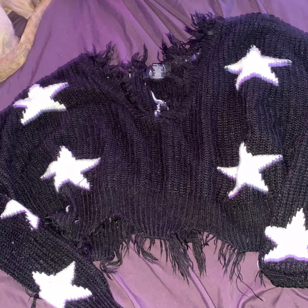 cropped black sweater with white stars on it
